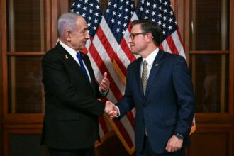 Speaker of the House Mike Johnson shakes hands with Israeli Prime Minister Benjamin Netanyahu as they meet at the US Capitol in Washington, DC, on July 8, 2025.