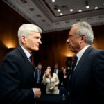Robert F. Kennedy Jr., Secretary of Health and Human Services, speaks with Sen. Bill Cassidy after testifying in his Senate Committee on Health, Education, Labor and Pensions confirmation hearing on January 30, 2025 in Washington, DC.