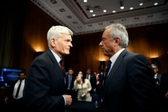 Robert F. Kennedy Jr., Secretary of Health and Human Services, speaks with Sen. Bill Cassidy after testifying in his Senate Committee on Health, Education, Labor and Pensions confirmation hearing on January 30, 2025 in Washington, DC.