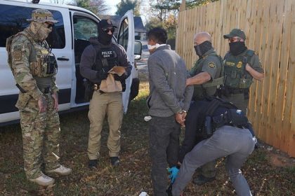 A person is detained by U.S. Border Patrol agents after being apprehended inside a fast food restaurant under construction on Nov. 19, 2025, in Charlotte, North Carolina.