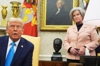 White House chief of staff Susie Wiles listens as President Donald Trump speaks in the Oval Office of the White House on Feb. 4, 2025.